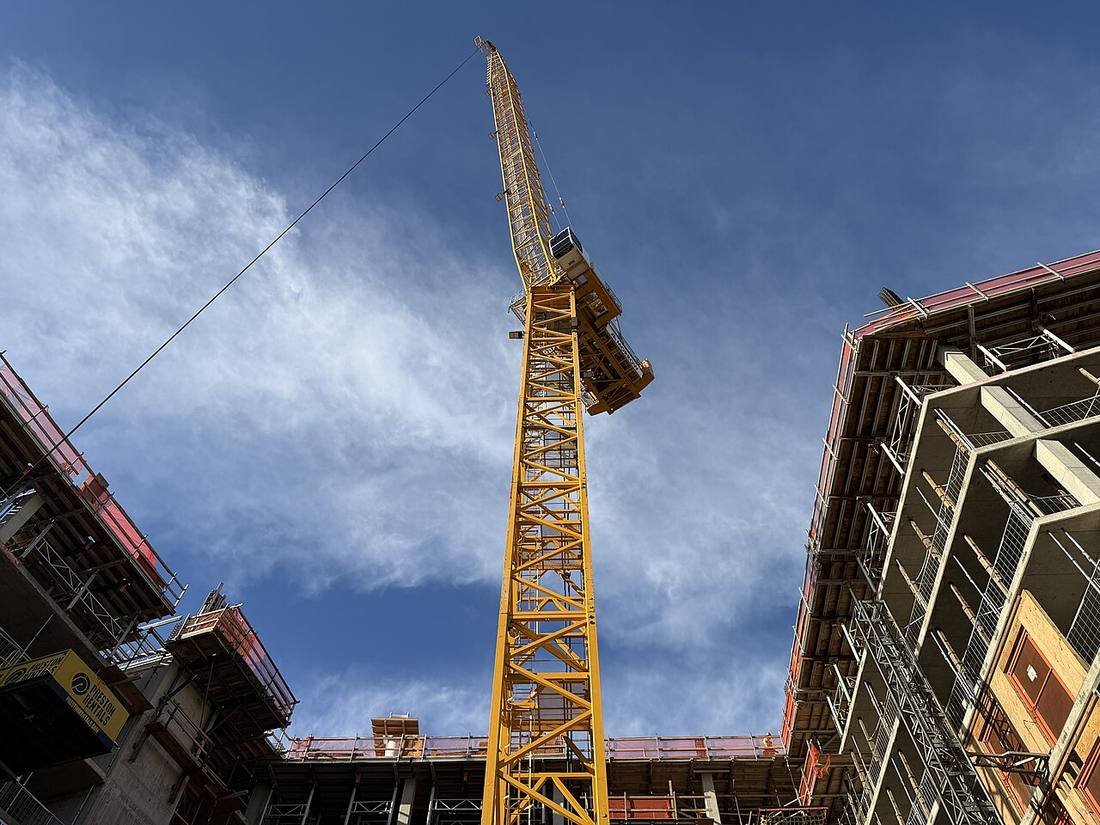 Tower crane over a rising concrete frame