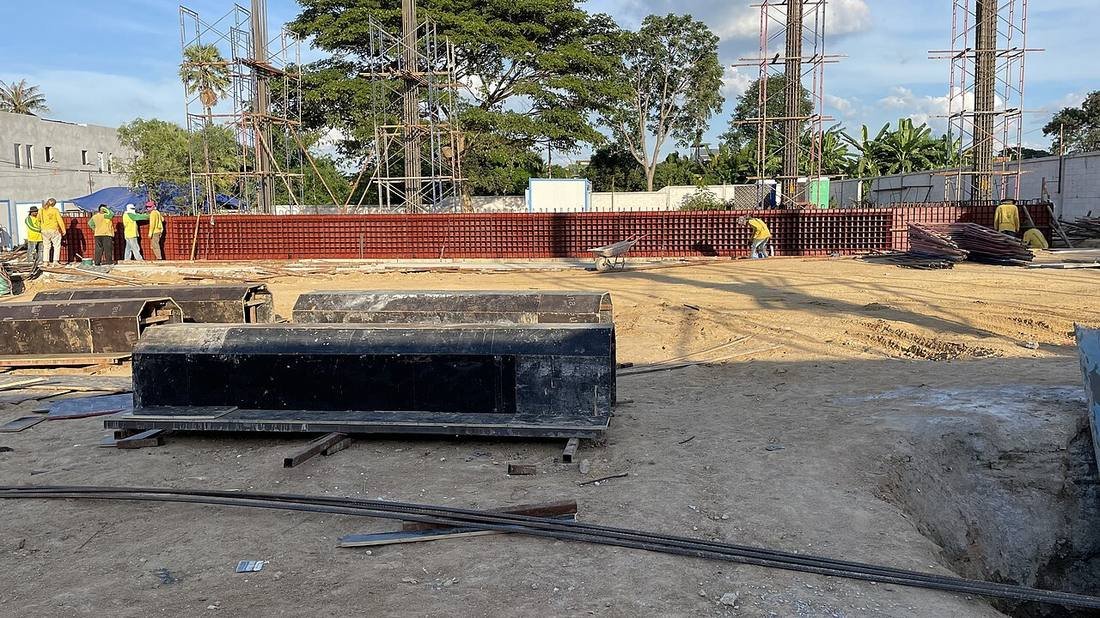 Engineer overseeing a concrete beam pour