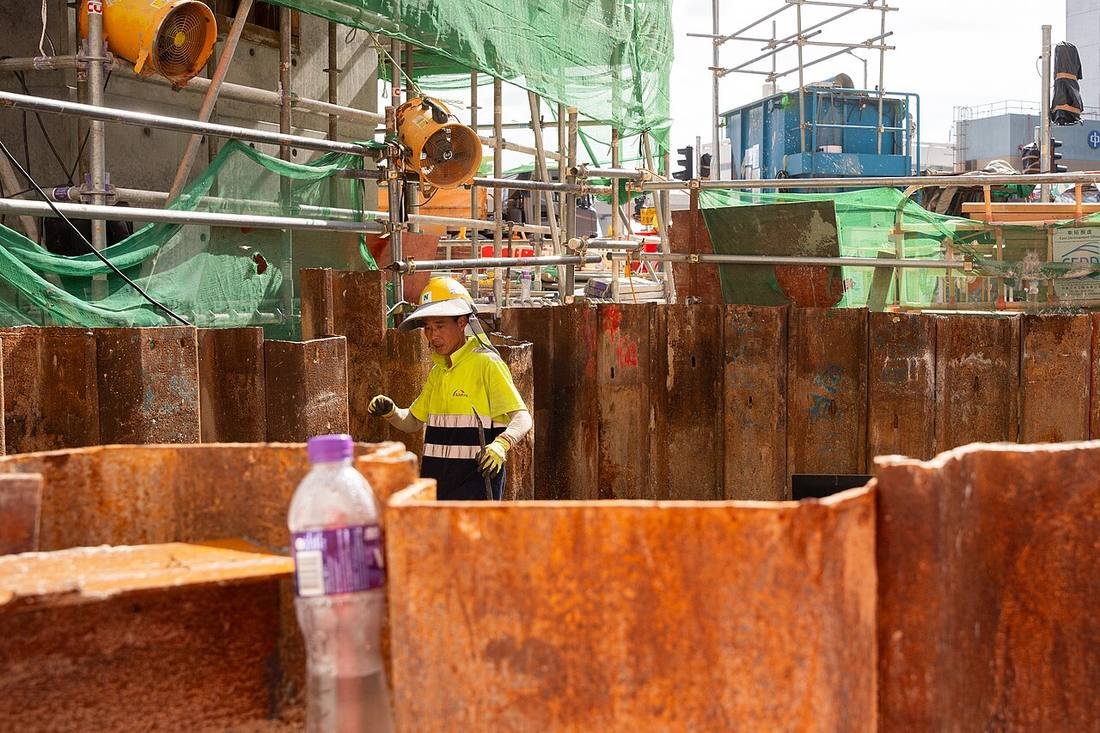 Site worker in hard hat and visor